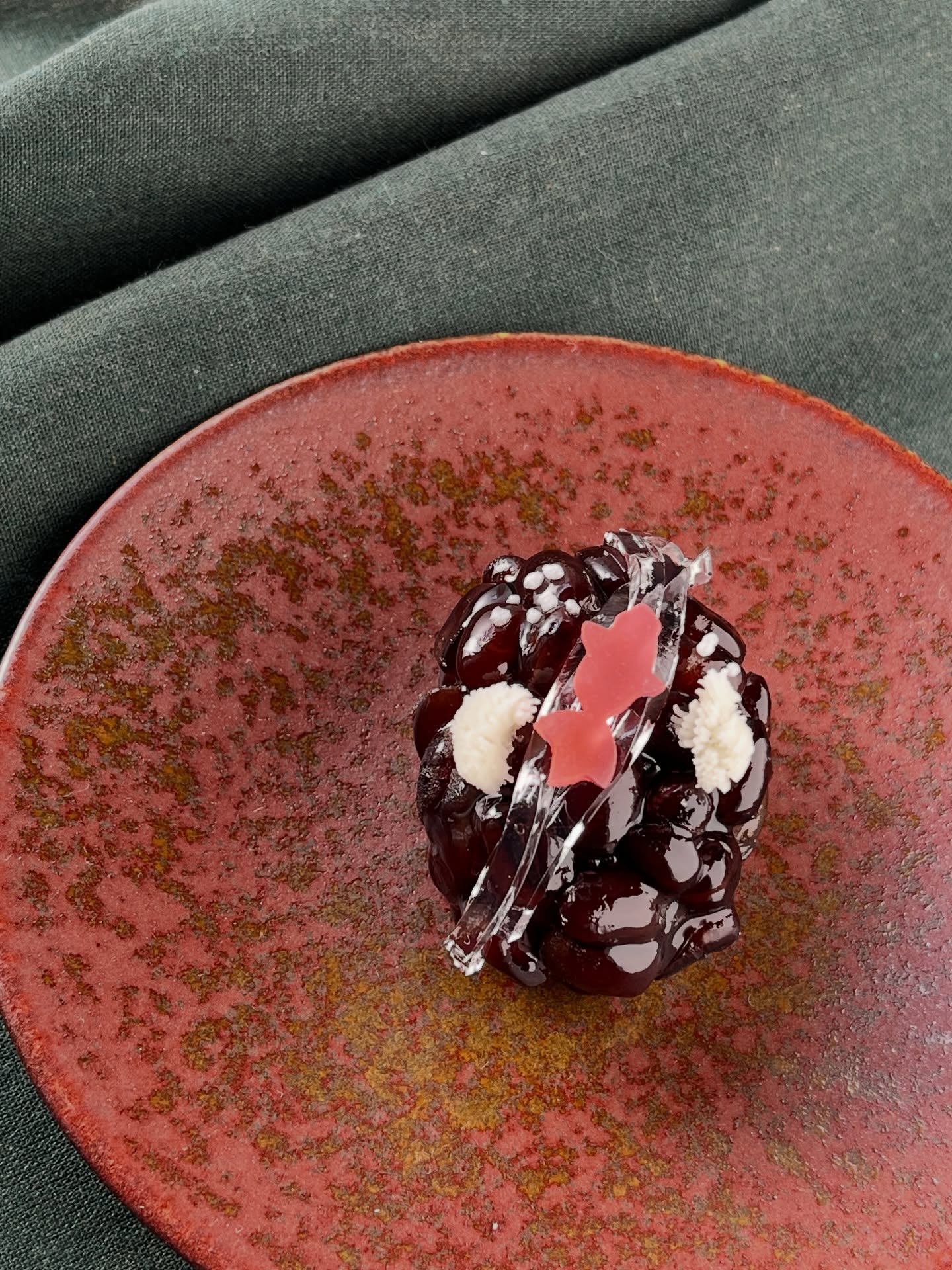 「Kingyo Daiko(金魚太鼓)」

This is inspired by the symbol of a Wadaiko (traditional Japanese drums) group. 
@kingyodaiko.nara 

Rich black sesame anko is wrapped in tender Dainagon kanoko beans, creating a beautiful balance of flavor and texture.
This is a special wagashi made exclusively for an upcoming taiko drum concert.

#wadawagashi #wagashi #japanesesweets #HandmadeWagashi 和菓子